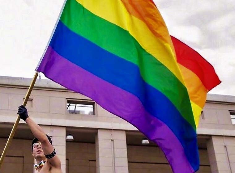 LGBTQ employee group raises Pride flag to kick off Pride Month around the globe
